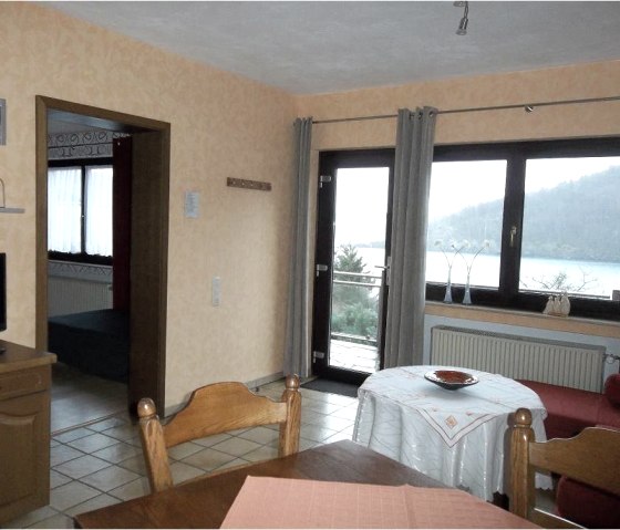 Living/dining room apartment I with view of the Rursee, © Getrud Lauscher